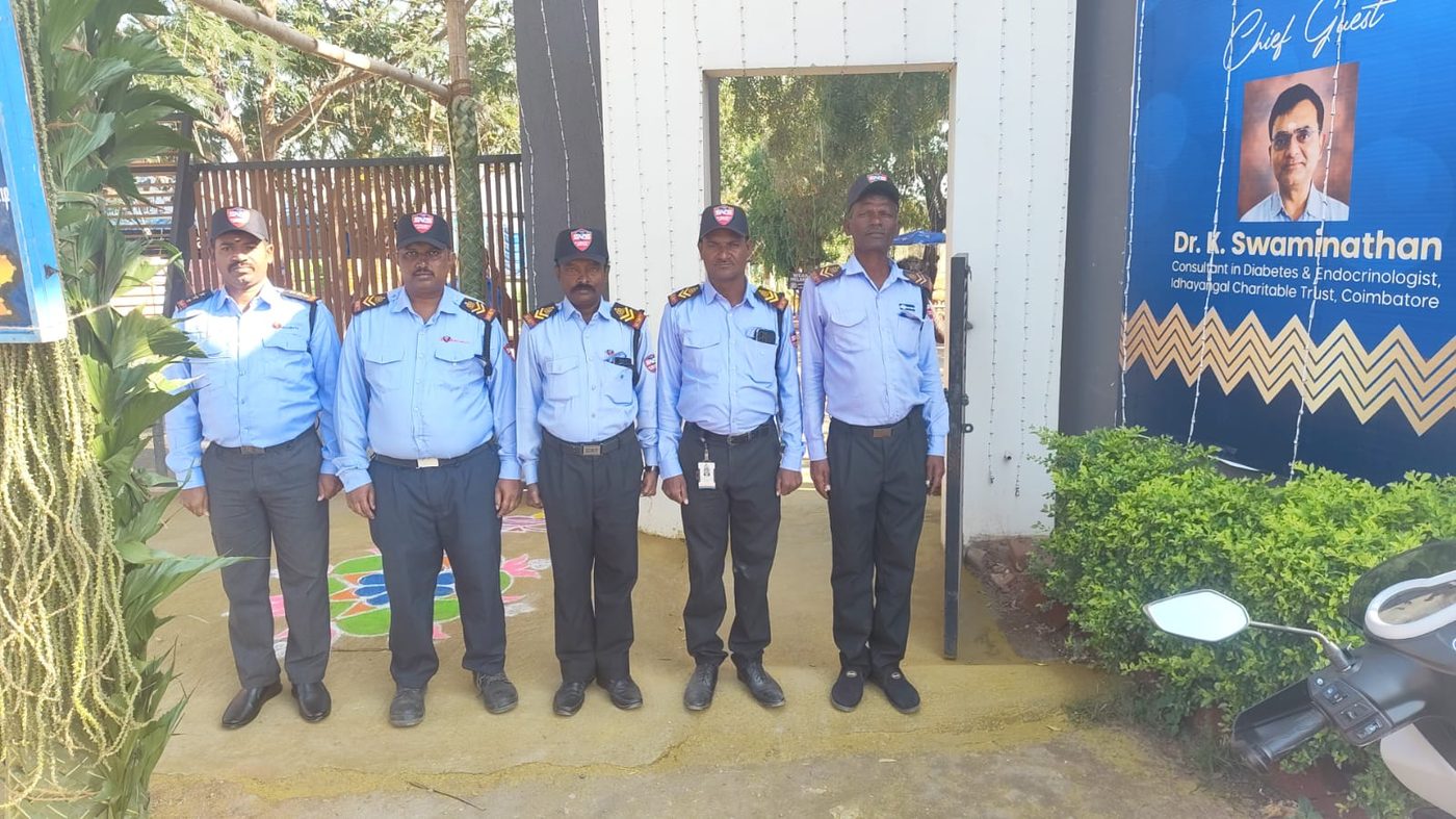 SV Security Services guards posted at a hospital entrance in Coimbatore.
