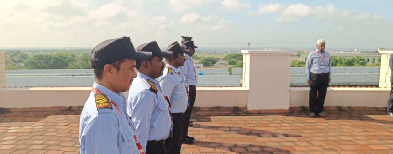SV Security Services guards standing in line at the Independence Day parade in Coimbatore, with their supervisor.