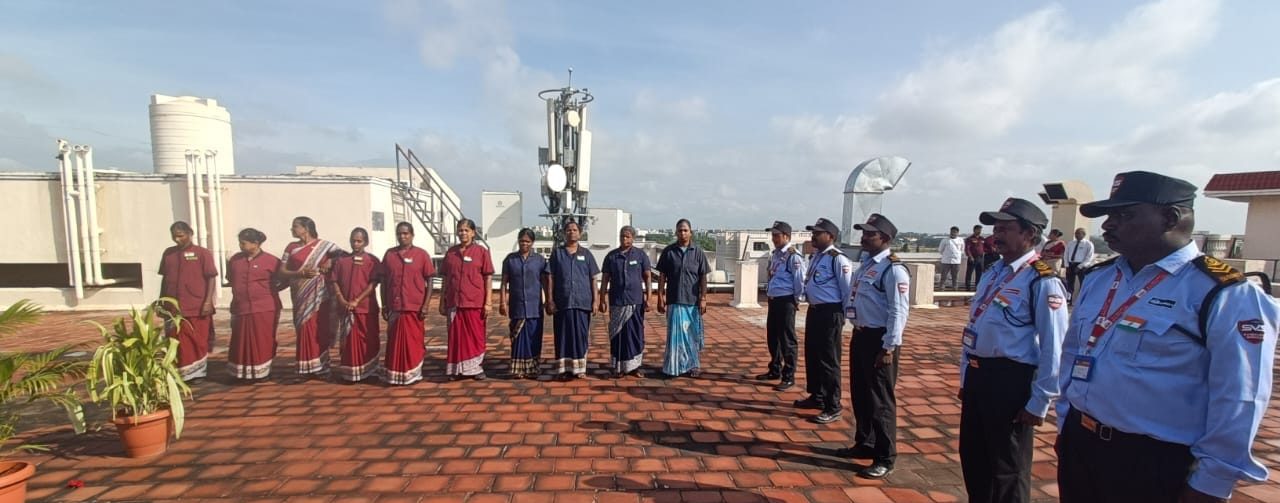SV Facilities housekeeping staff and security guards lined up together at a client site in Coimbatore.