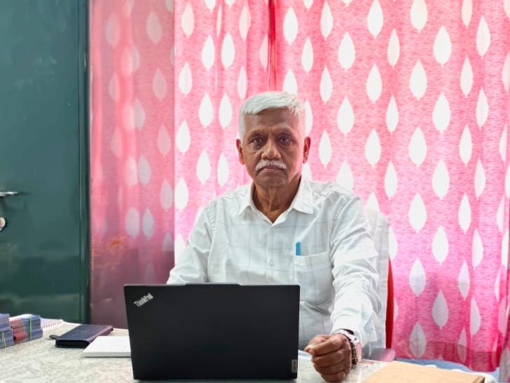 Mr. Sengole Raj S, Director of SV Security Services, at his desk in the Singanallur office.