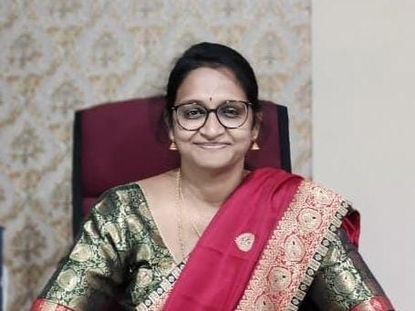 Dr. Sweety Regina Mary S, Director of SV Facilities Private Limited and SV Security Services, at her desk.